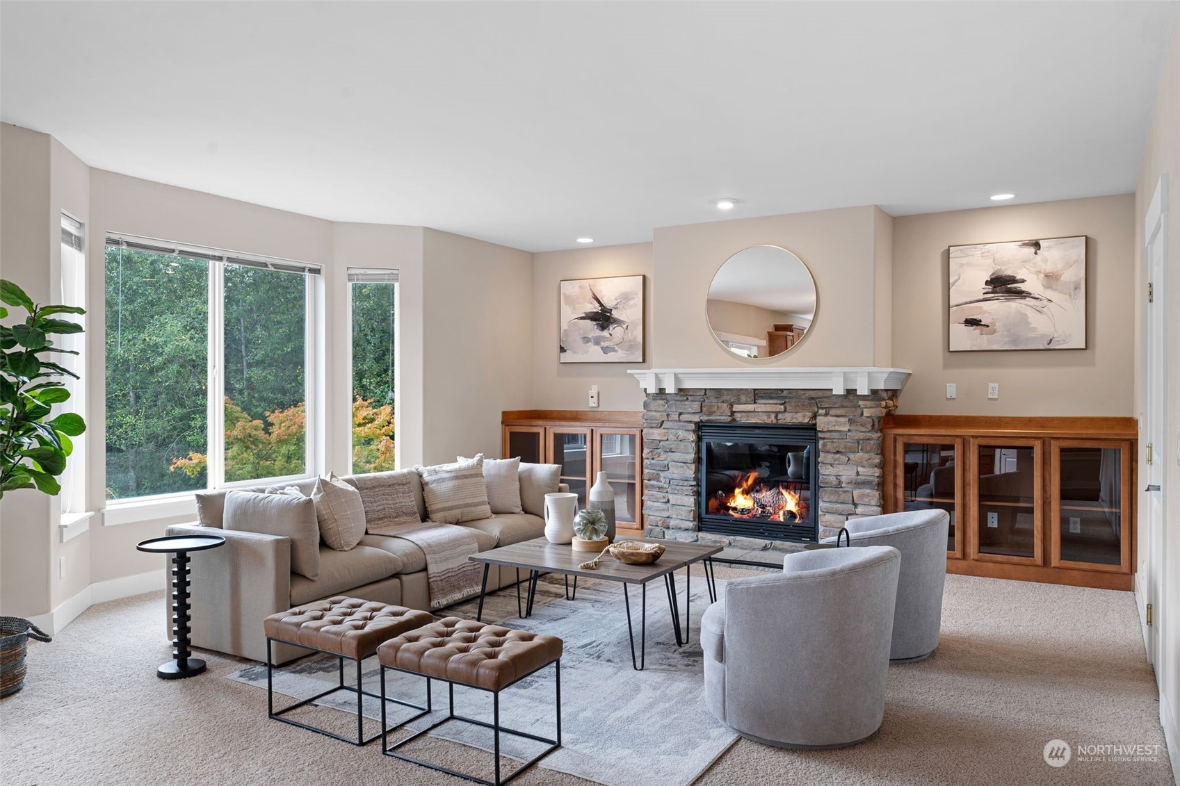 906 Jericho Place Northeast Renton, WA 98059 - Photo 9 of 39 a living room with furniture and a fireplace