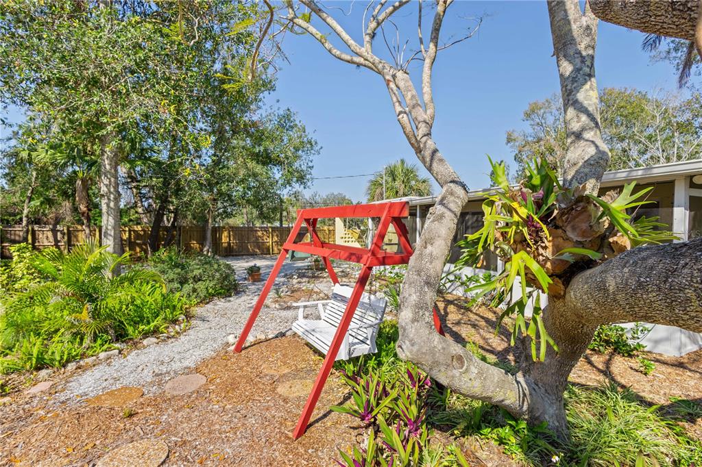 109 Burney Road Osprey, FL 34229 - Photo 9 of 56 Front yard swing for bird watching
