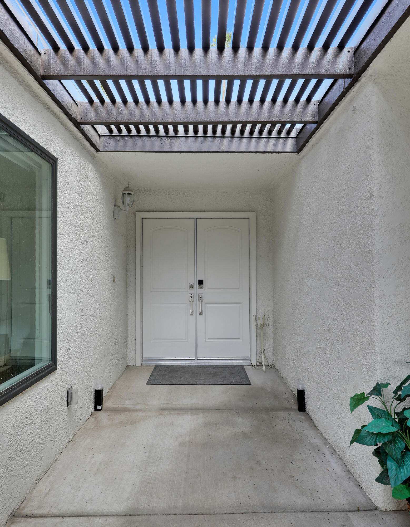 159 Torremolinos Drive Rancho Mirage, CA 92270 - Photo 14 of 17 a view of a livingroom with wooden floor and window