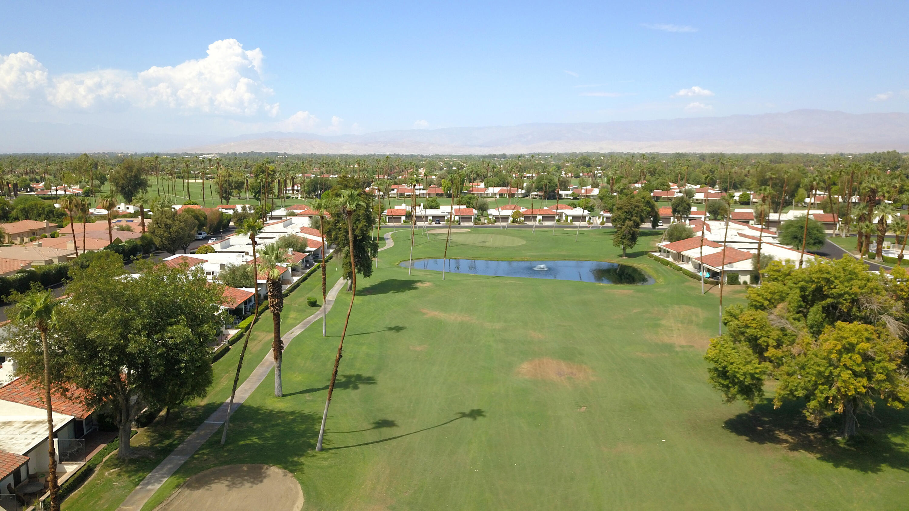 159 Torremolinos Drive Rancho Mirage, CA 92270 - Photo 15 of 17 an aerial view of residential houses with outdoor space and trees