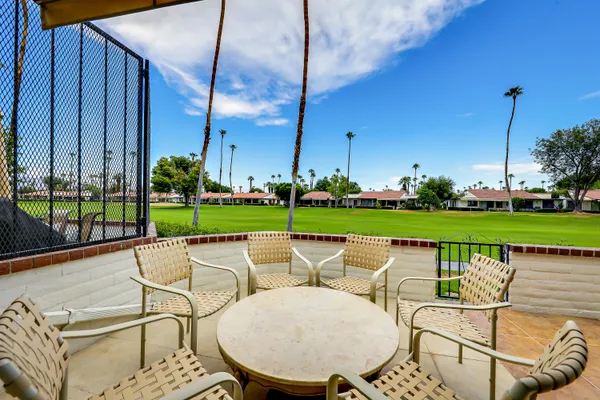a yard with table and chairs