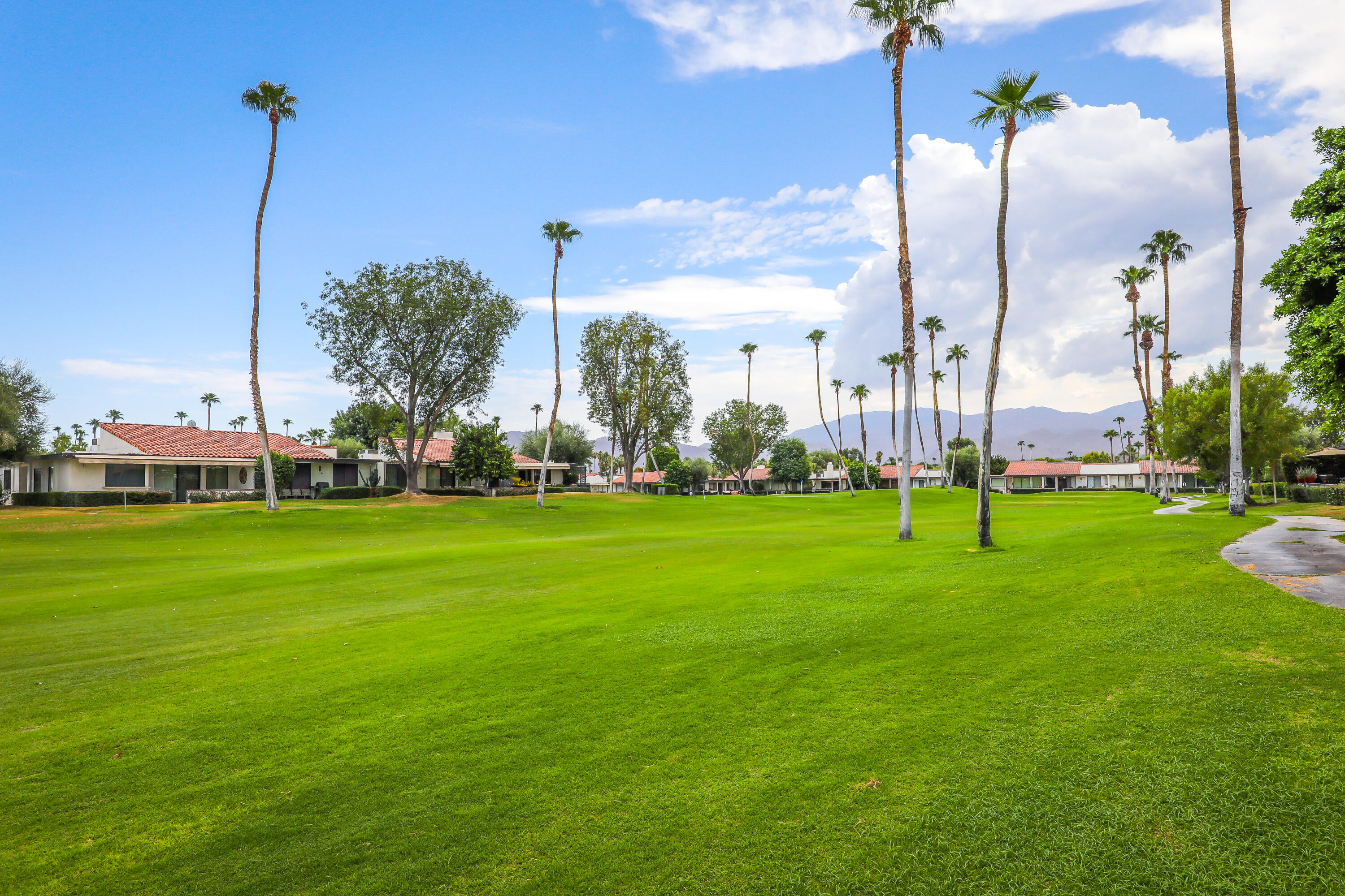 159 Torremolinos Drive Rancho Mirage, CA 92270 - Photo 3 of 17 a view of a park with a large tree