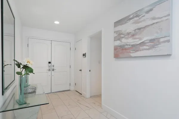 a view of entryway with wooden floor
