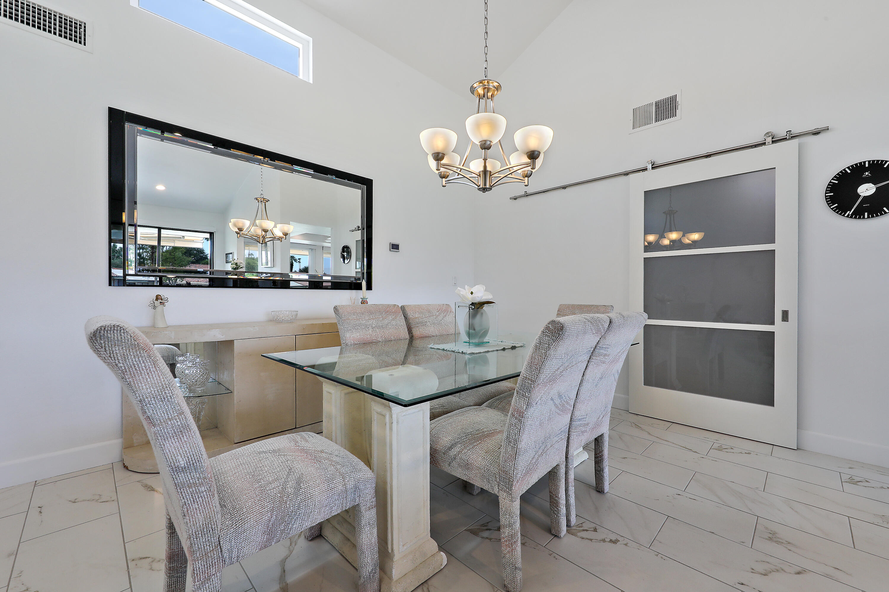 159 Torremolinos Drive Rancho Mirage, CA 92270 - Photo 5 of 17 a view of a dining room with furniture and chandelier