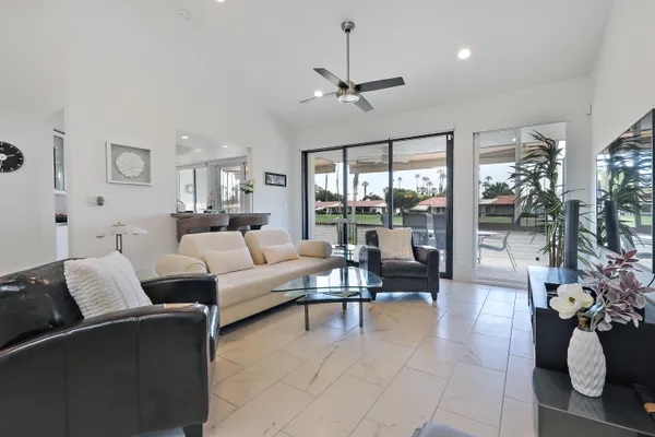a living room with furniture and a large window