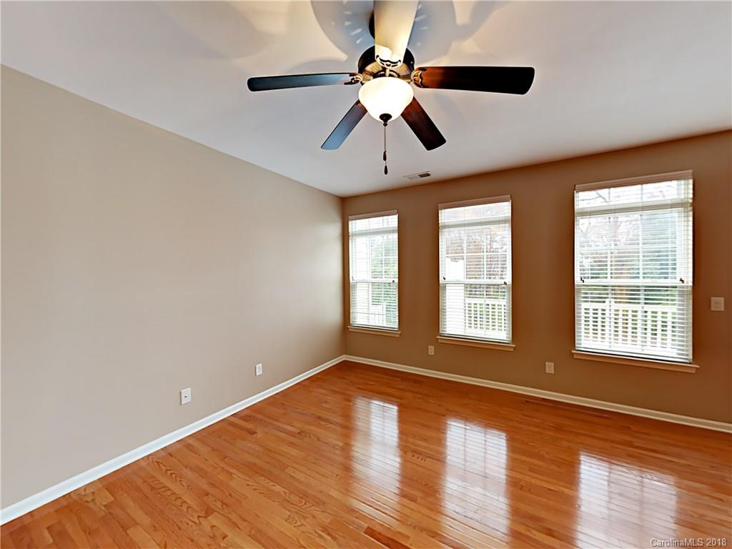 813 Kimbrough Court Davidson, NC 28036 - Photo 2 of 22 a view of an empty room with window and wooden floor