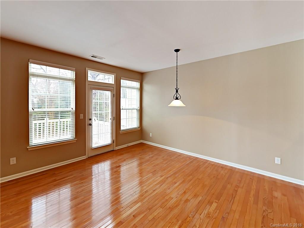 813 Kimbrough Court Davidson, NC 28036 - Photo 11 of 22 wooden floor in an empty room with a window