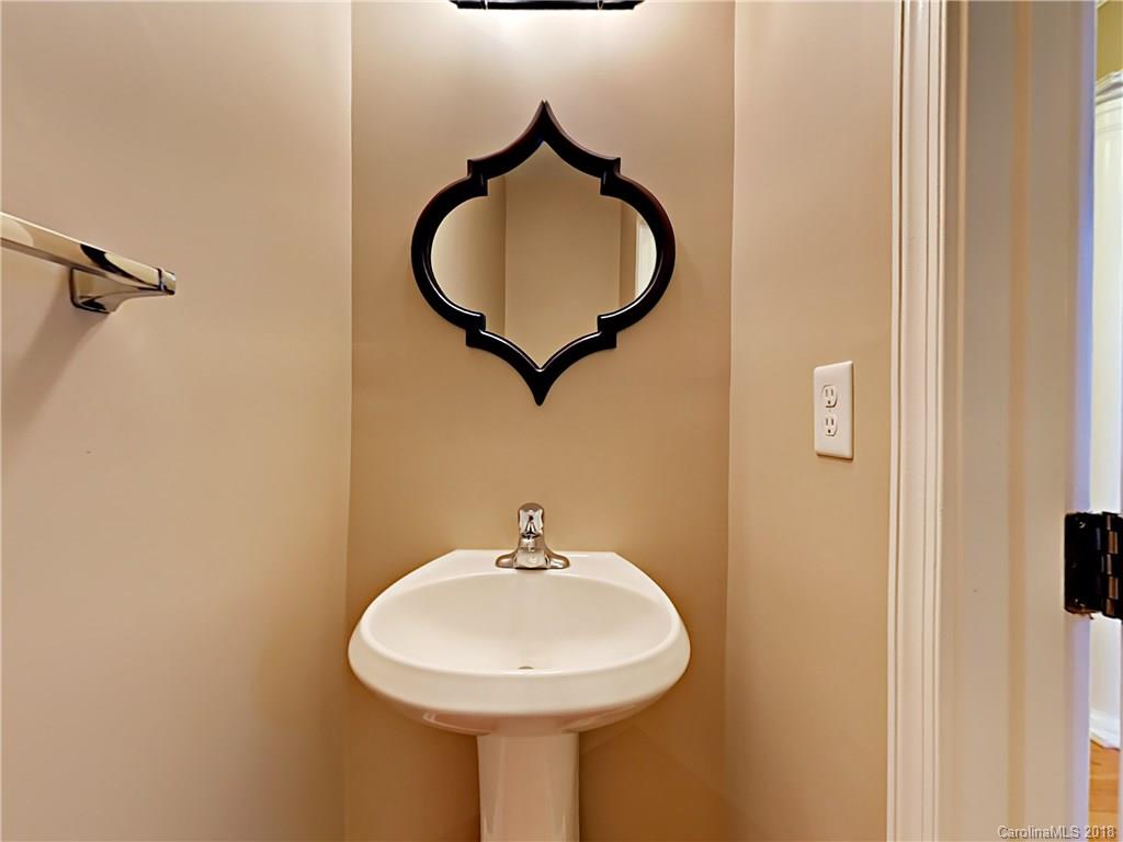 813 Kimbrough Court Davidson, NC 28036 - Photo 12 of 22 a bathroom with a sink and a mirror