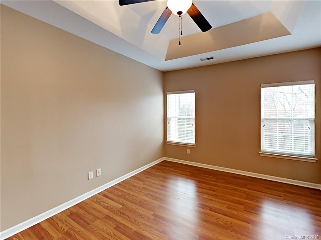 813 Kimbrough Court Davidson, NC 28036 - Photo 13 of 22 wooden floor in an empty room with a window