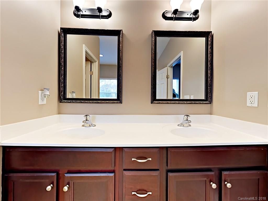 813 Kimbrough Court Davidson, NC 28036 - Photo 14 of 22 a bathroom with a sink and a mirror