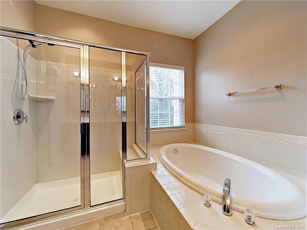 813 Kimbrough Court Davidson, NC 28036 - Photo 15 of 22 a bathroom with a tub and a shower
