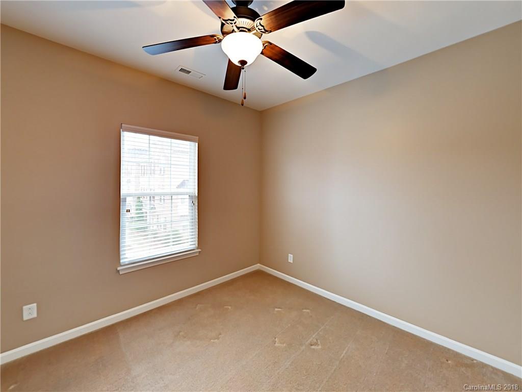 813 Kimbrough Court Davidson, NC 28036 - Photo 16 of 22 an empty room with a window and a fan