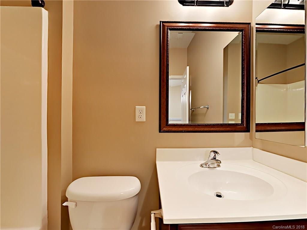 813 Kimbrough Court Davidson, NC 28036 - Photo 18 of 22 a bathroom with a sink and a mirror