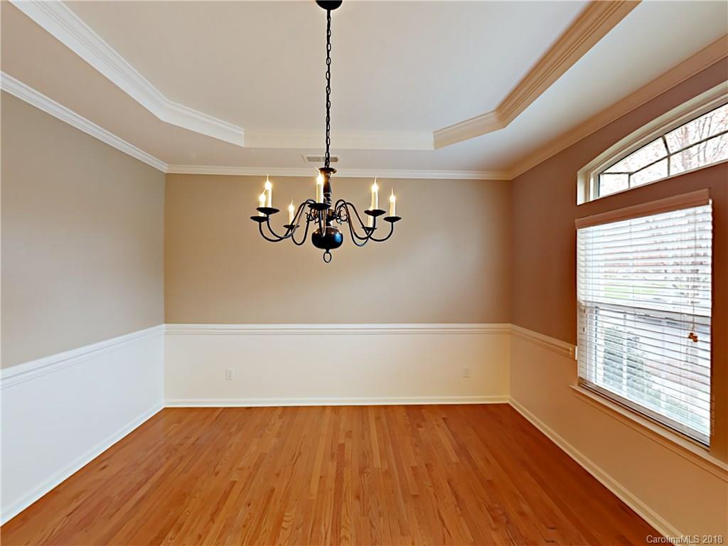 813 Kimbrough Court Davidson, NC 28036 - Photo 3 of 22 a view of an empty room with wooden floor and a window