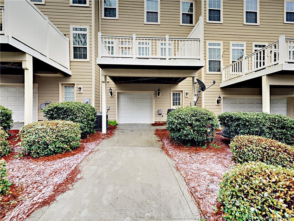813 Kimbrough Court Davidson, NC 28036 - Photo 22 of 22 a front view of a house with a garden