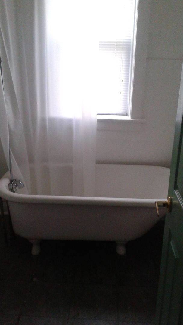2421 North Harding Avenue, Unit 1 Chicago, IL 60647 - Photo 9 of 14 a bathroom with a sink and a window