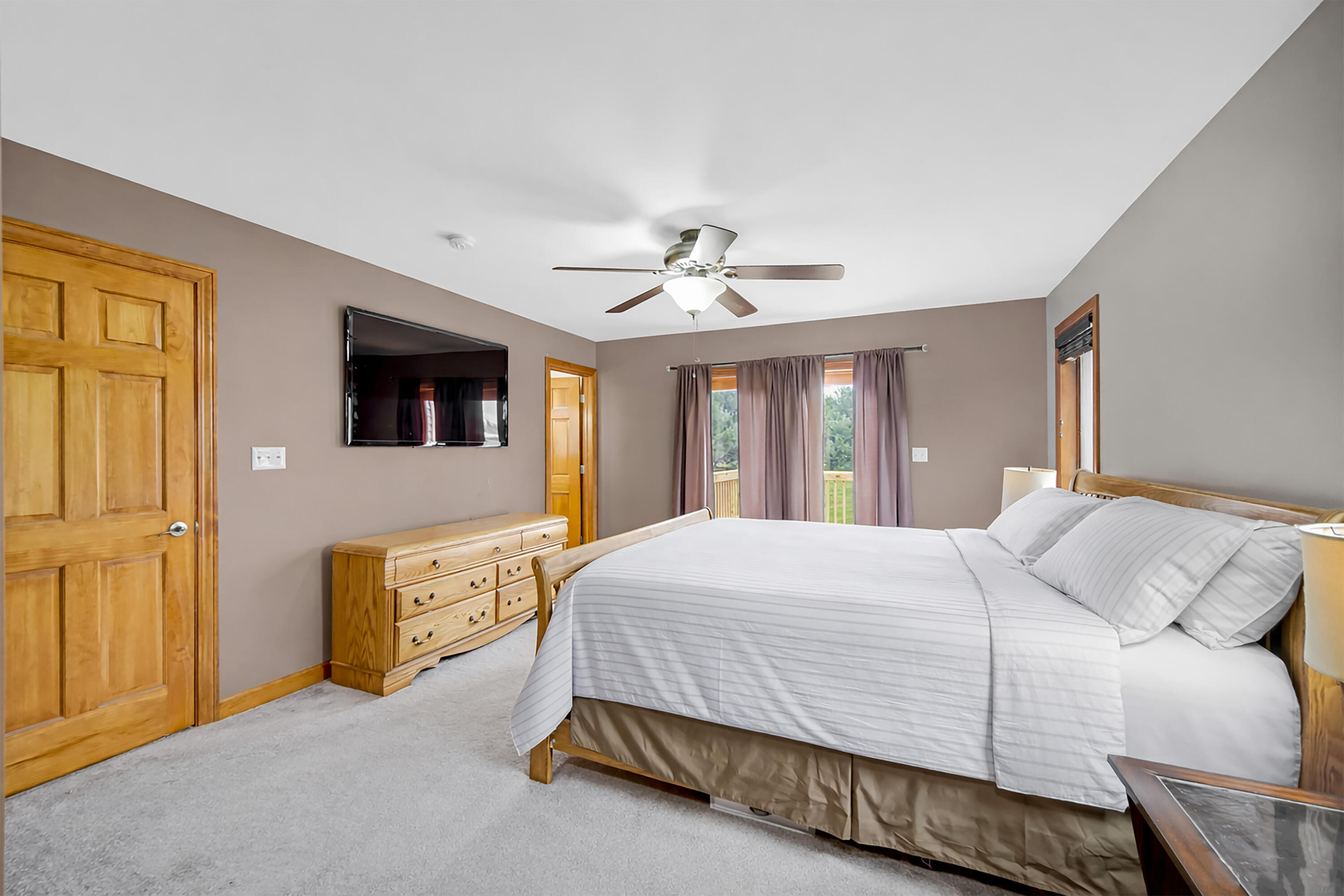 1750 West 174th Place Lowell, IN 46356 - Photo 11 of 23 a bedroom with a bed and a chandelier