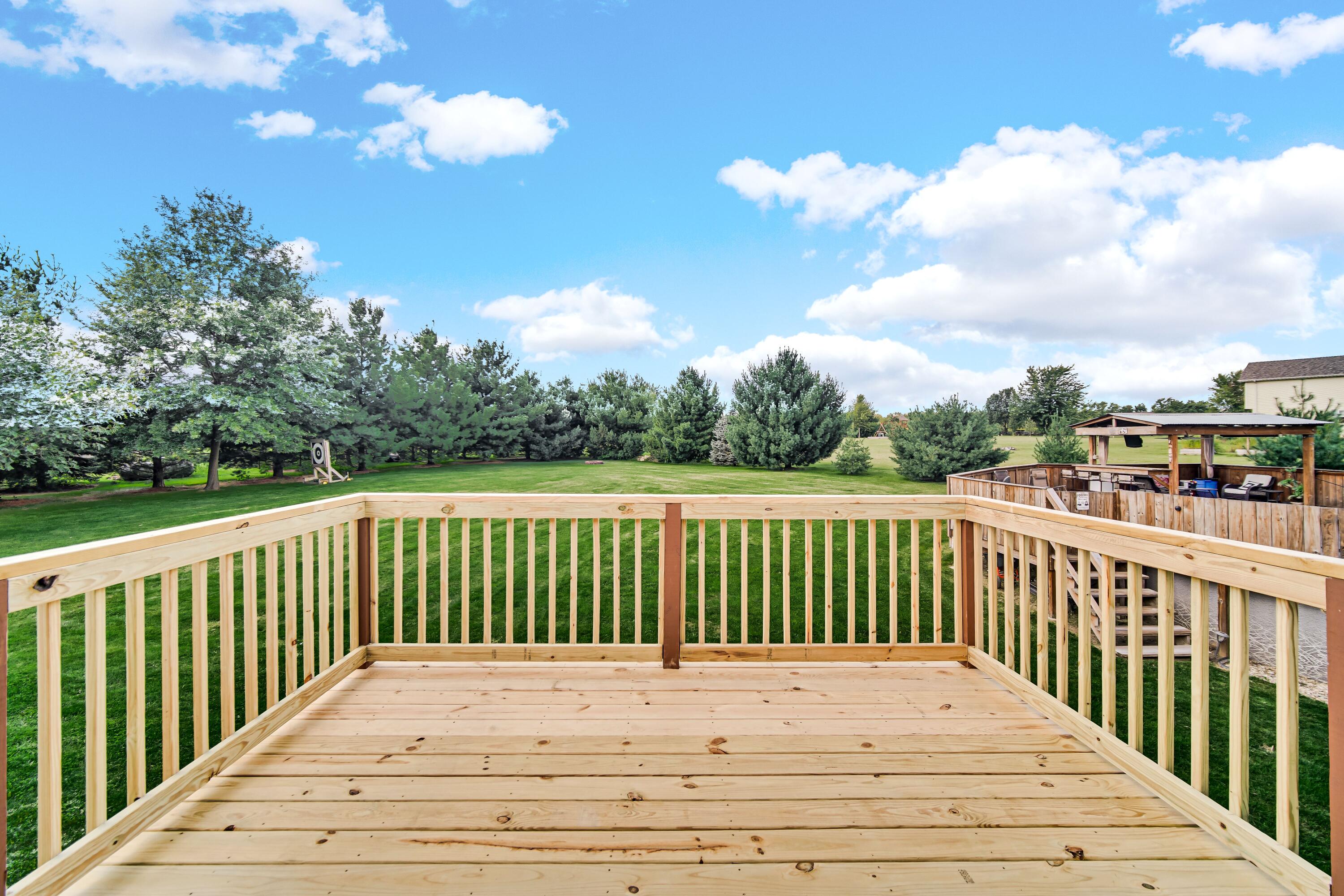 1750 West 174th Place Lowell, IN 46356 - Photo 14 of 23 a view of balcony with wooden floor and fence