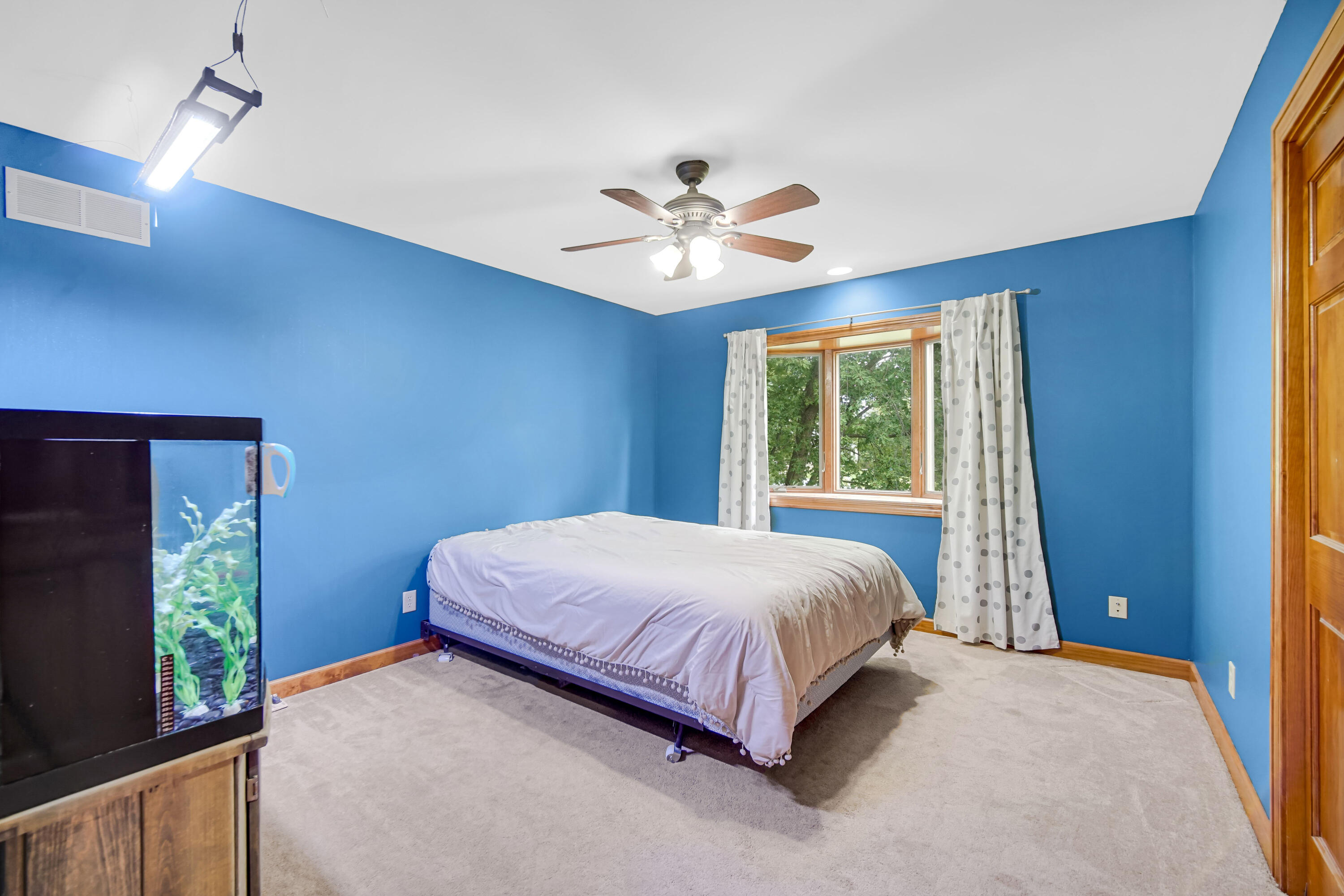 1750 West 174th Place Lowell, IN 46356 - Photo 15 of 23 a bedroom with a bed and a chandelier
