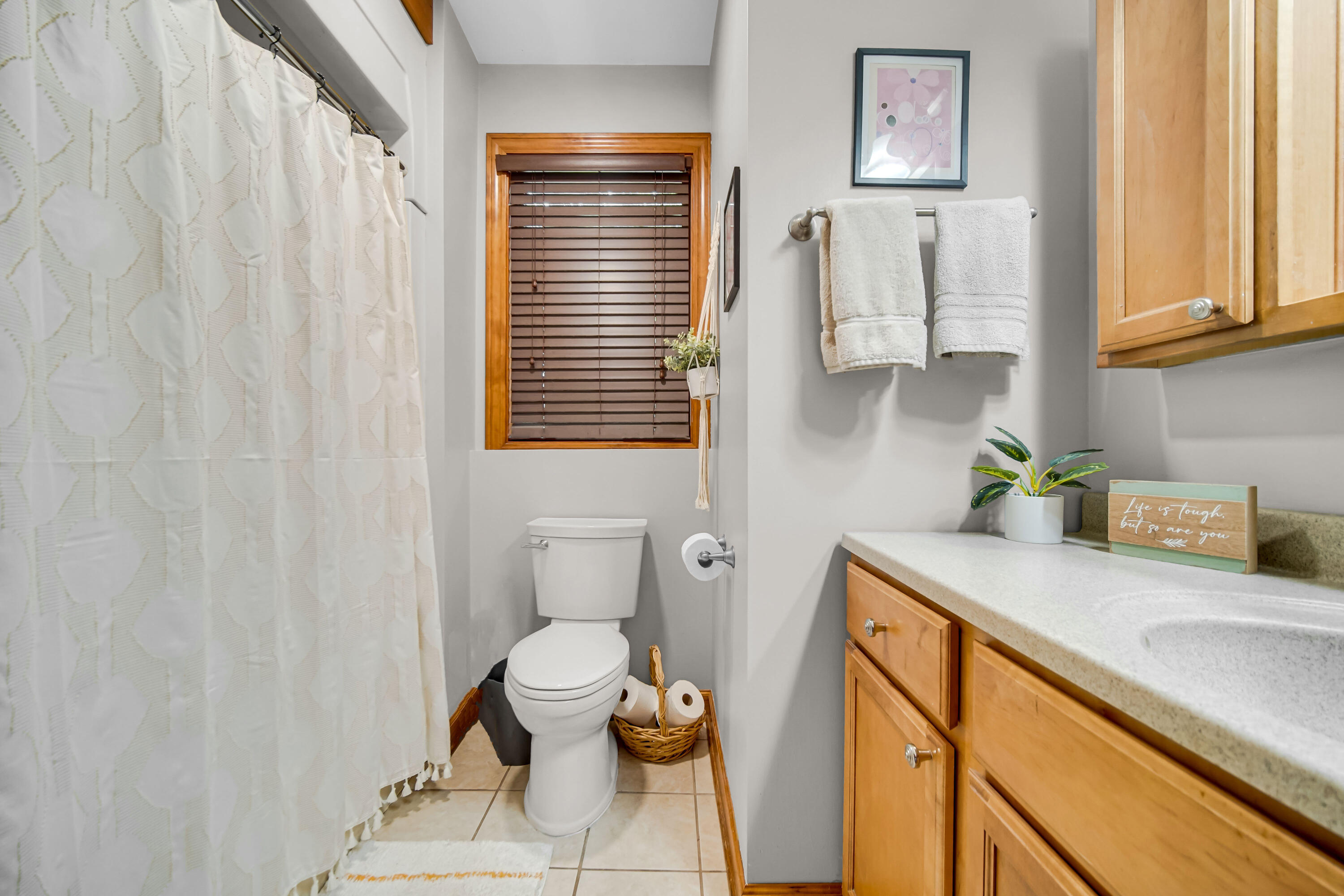 1750 West 174th Place Lowell, IN 46356 - Photo 16 of 23 a bathroom with a sink a toilet and a window