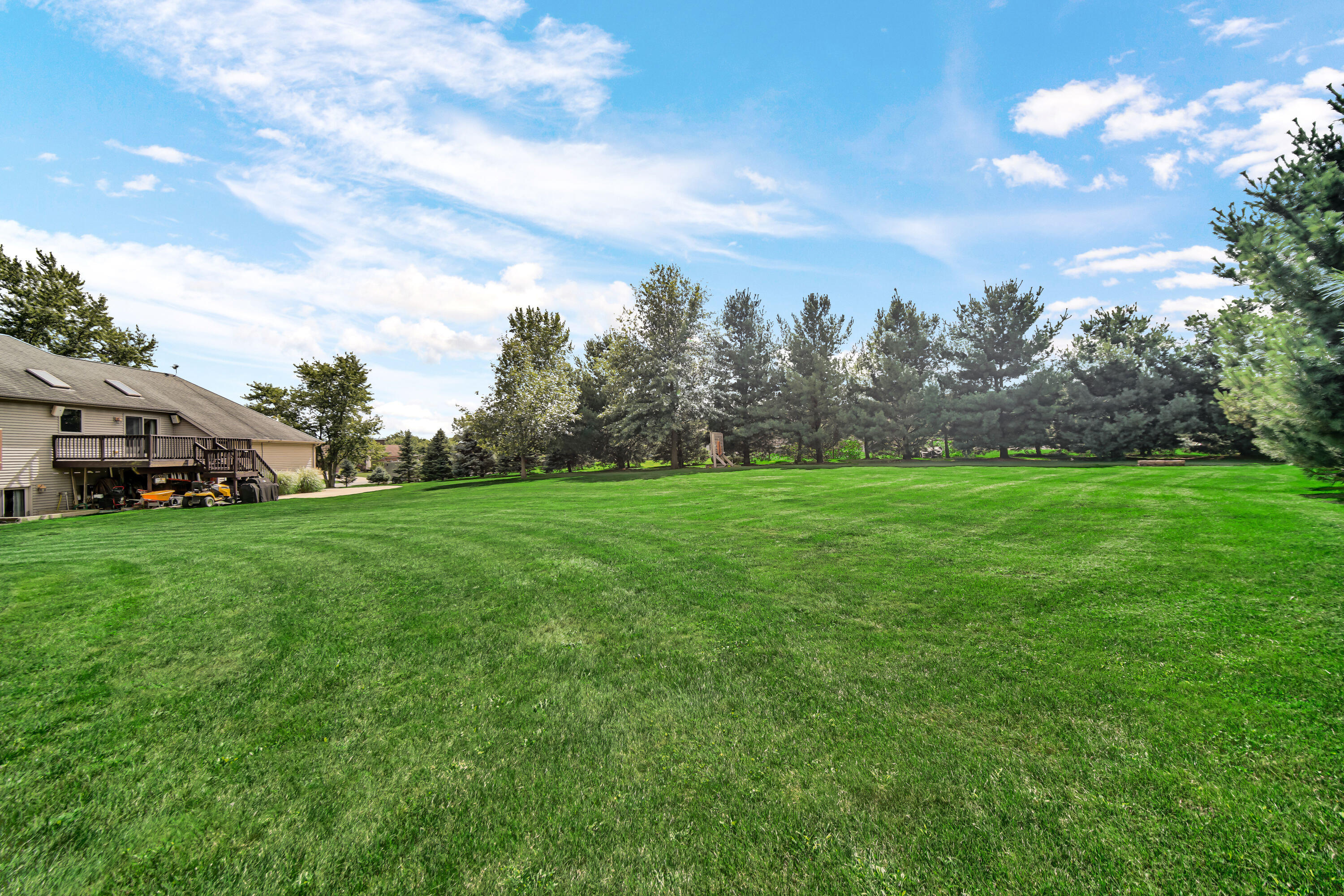 1750 West 174th Place Lowell, IN 46356 - Photo 22 of 23 a view of a green field with wooden fence