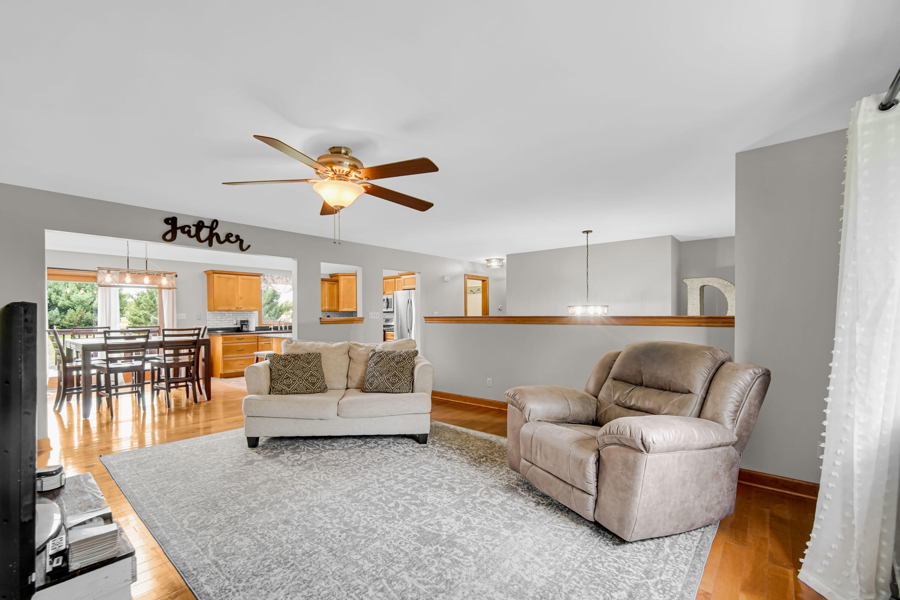 1750 West 174th Place Lowell, IN 46356 - Photo 5 of 23 a living room with furniture and a table with wooden floor