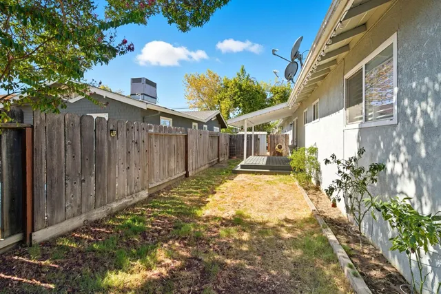 a view of outdoor space with wooden floor