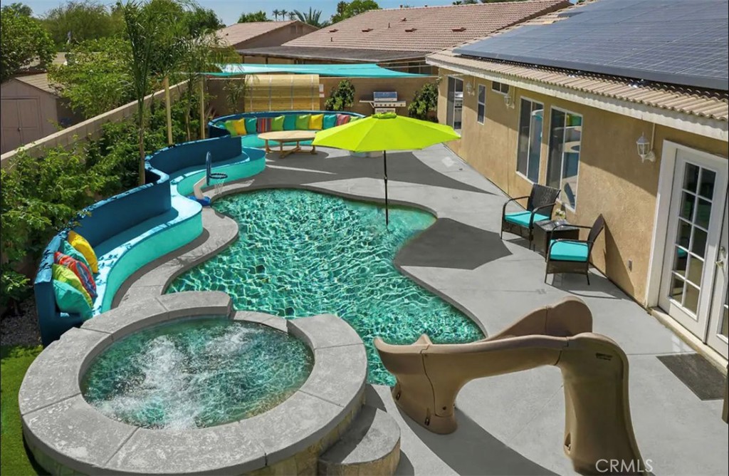 83250 Beverly Court Indio, CA 92201 - Photo 2 of 29 a view of a swimming pool with a patio