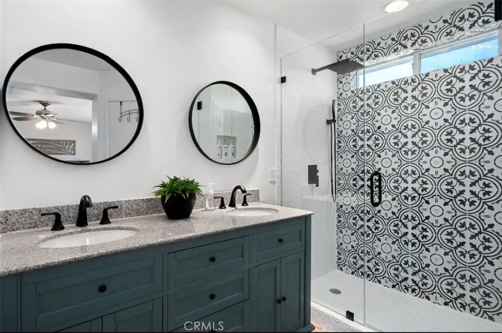83250 Beverly Court Indio, CA 92201 - Photo 22 of 29 a bathroom with a sink and a mirror