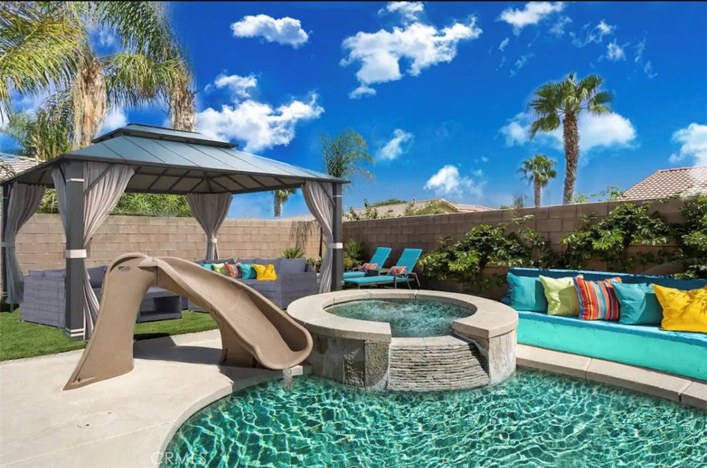 83250 Beverly Court Indio, CA 92201 - Photo 3 of 29 a view of outdoor space and swimming pool