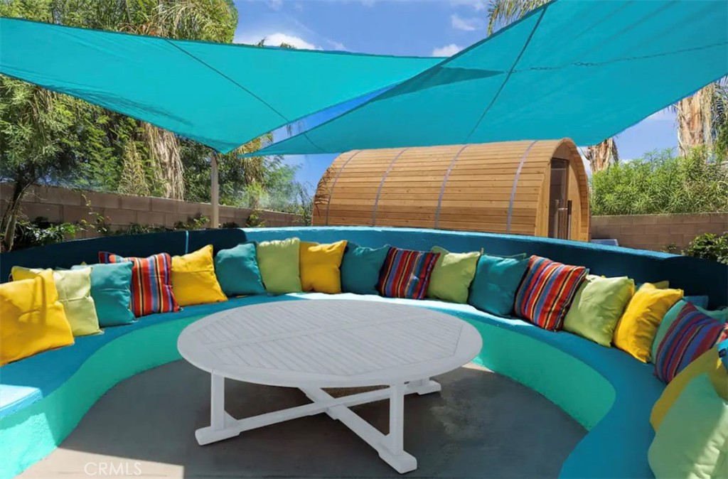 83250 Beverly Court Indio, CA 92201 - Photo 4 of 29 a balcony with furniture and a potted plant