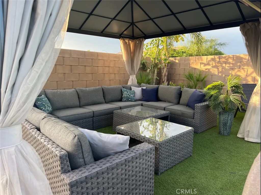 83250 Beverly Court Indio, CA 92201 - Photo 5 of 29 a living room with furniture and a yard