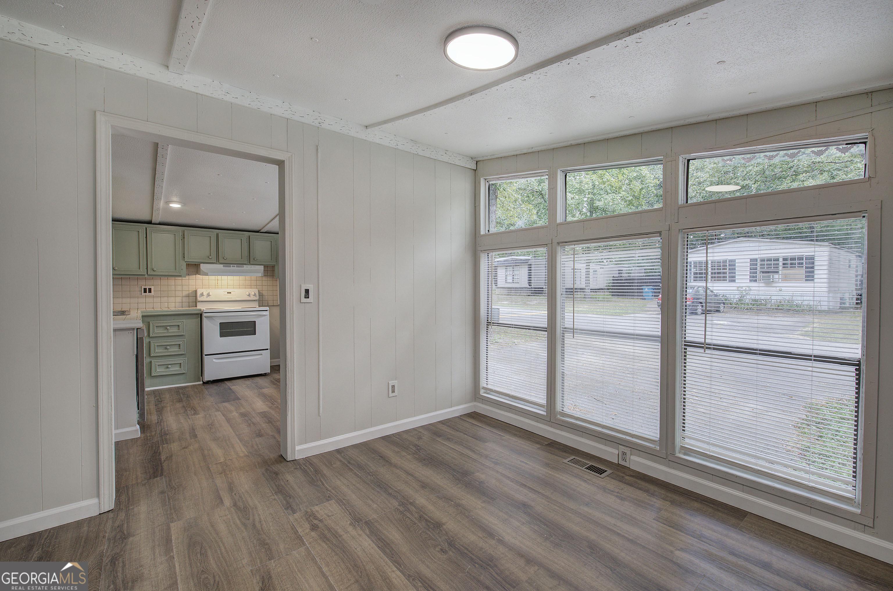264 East Big Indian Trail Northeast Rome, GA 30165 - Photo 14 of 31 wooden floor in an empty room with a window