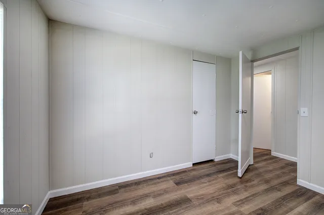 a view of room with wooden floor