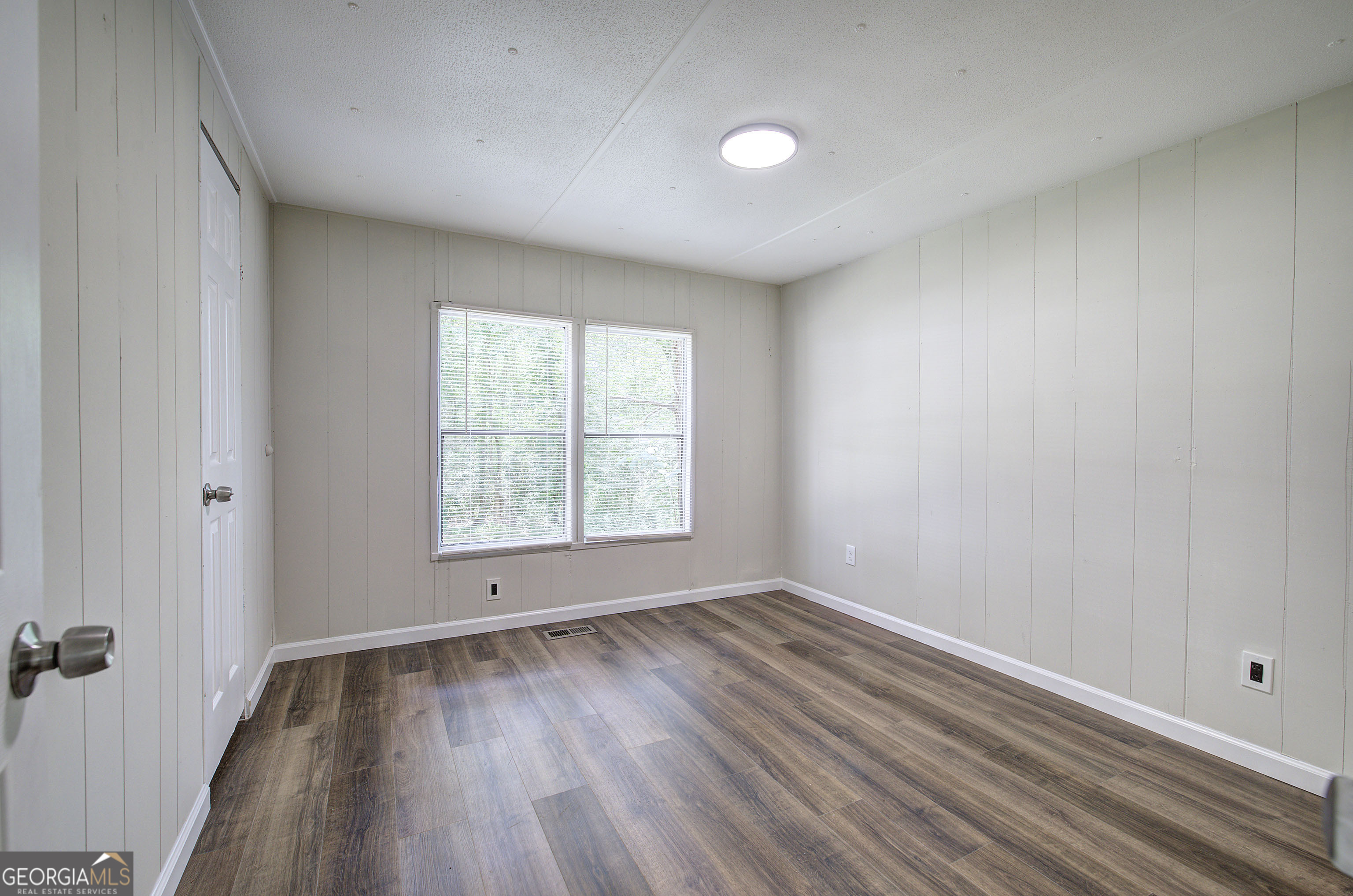 264 East Big Indian Trail Northeast Rome, GA 30165 - Photo 29 of 31 wooden floor in an empty room with a window
