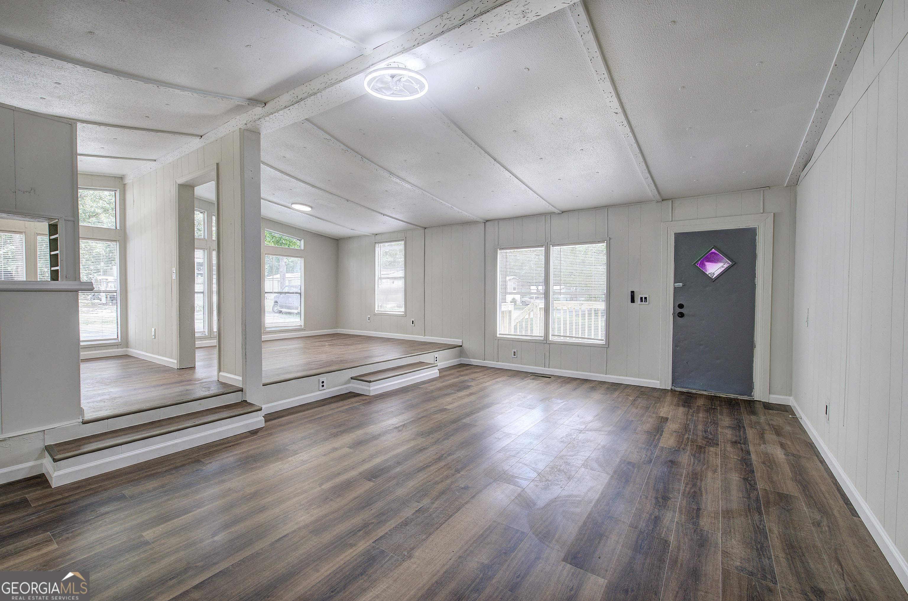264 East Big Indian Trail Northeast Rome, GA 30165 - Photo 8 of 31 an empty room with wooden floor and windows