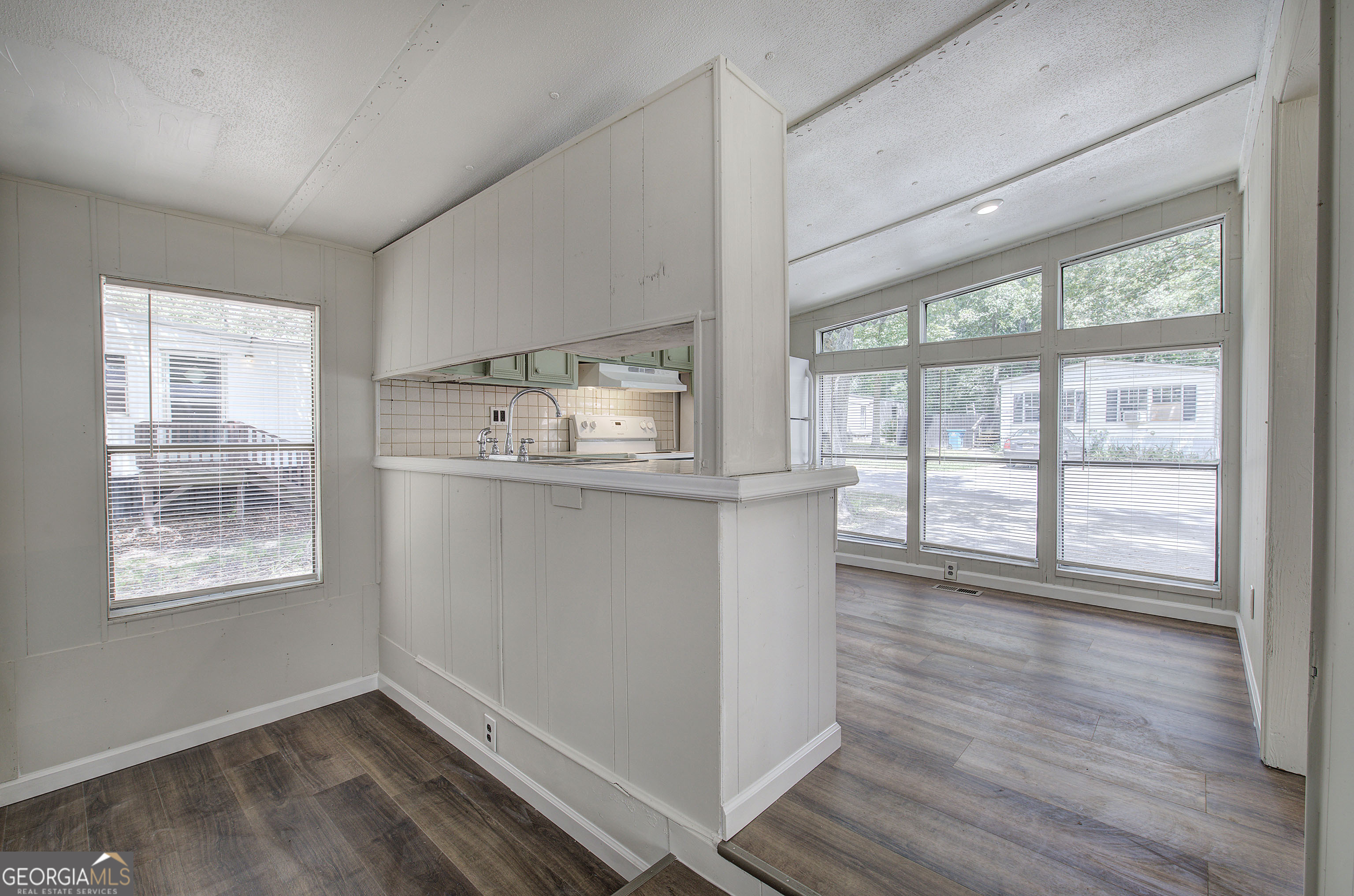 264 East Big Indian Trail Northeast Rome, GA 30165 - Photo 10 of 31 a view of an empty room with wooden floor and a window