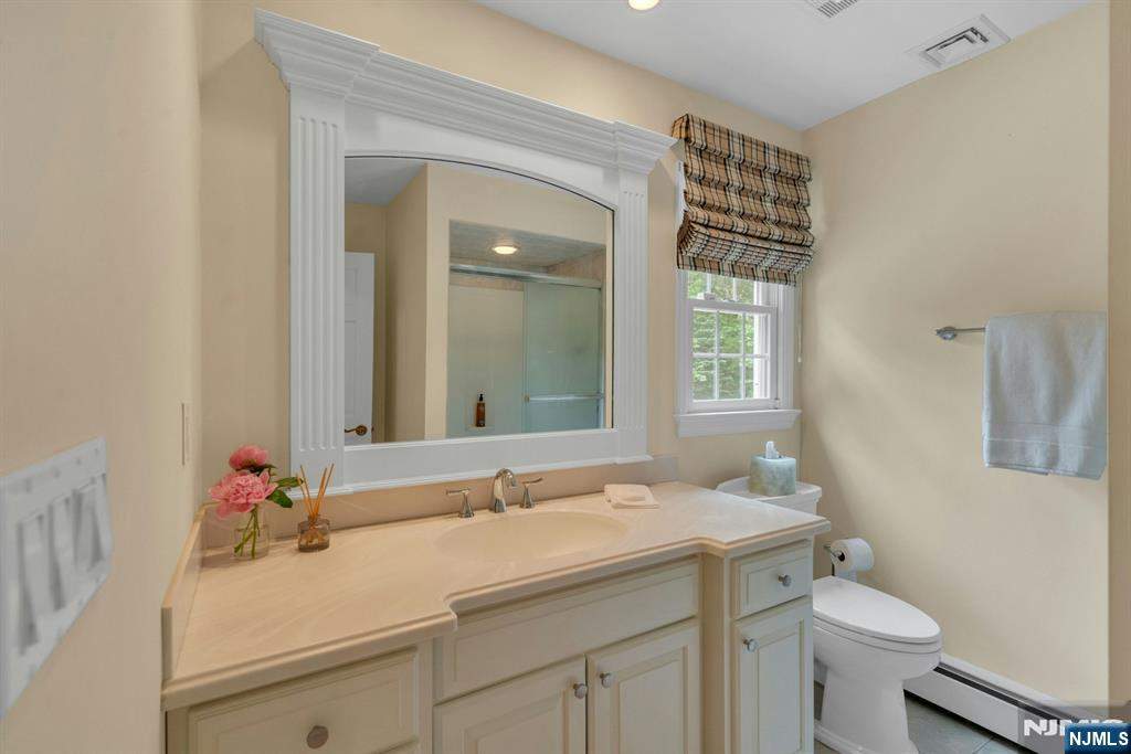 48 Hopper Farm Road Upper Saddle River, NJ 07458 - Photo 24 of 43 a bathroom with a sink and a toilet