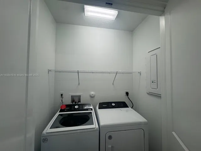 a room with a sink and cabinets