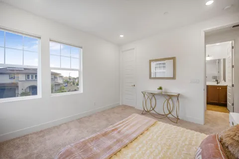 a bedroom with furniture and a window