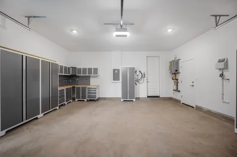 a view of water heater room with ceiling fan