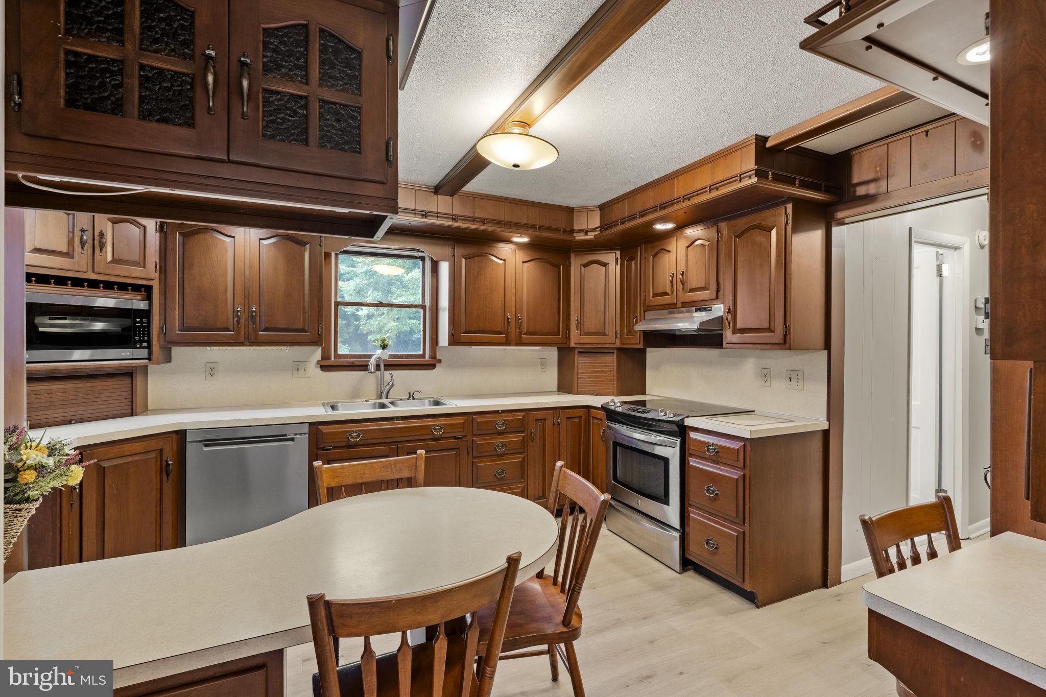 65 Compass Road Parkesburg, PA 19365 - Photo 31 of 61 Warm wood tones in a cozy kitchen.