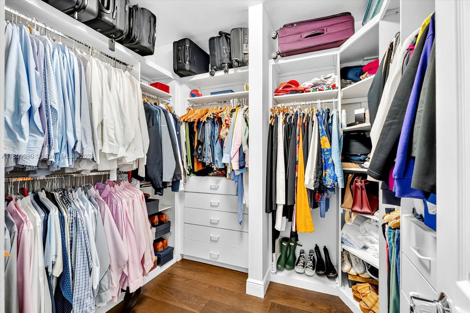 2127 Brickell Avenue, Unit 2005 Miami, FL 33129 - Photo 27 of 53 a view of walk in closet with clothes and shoes