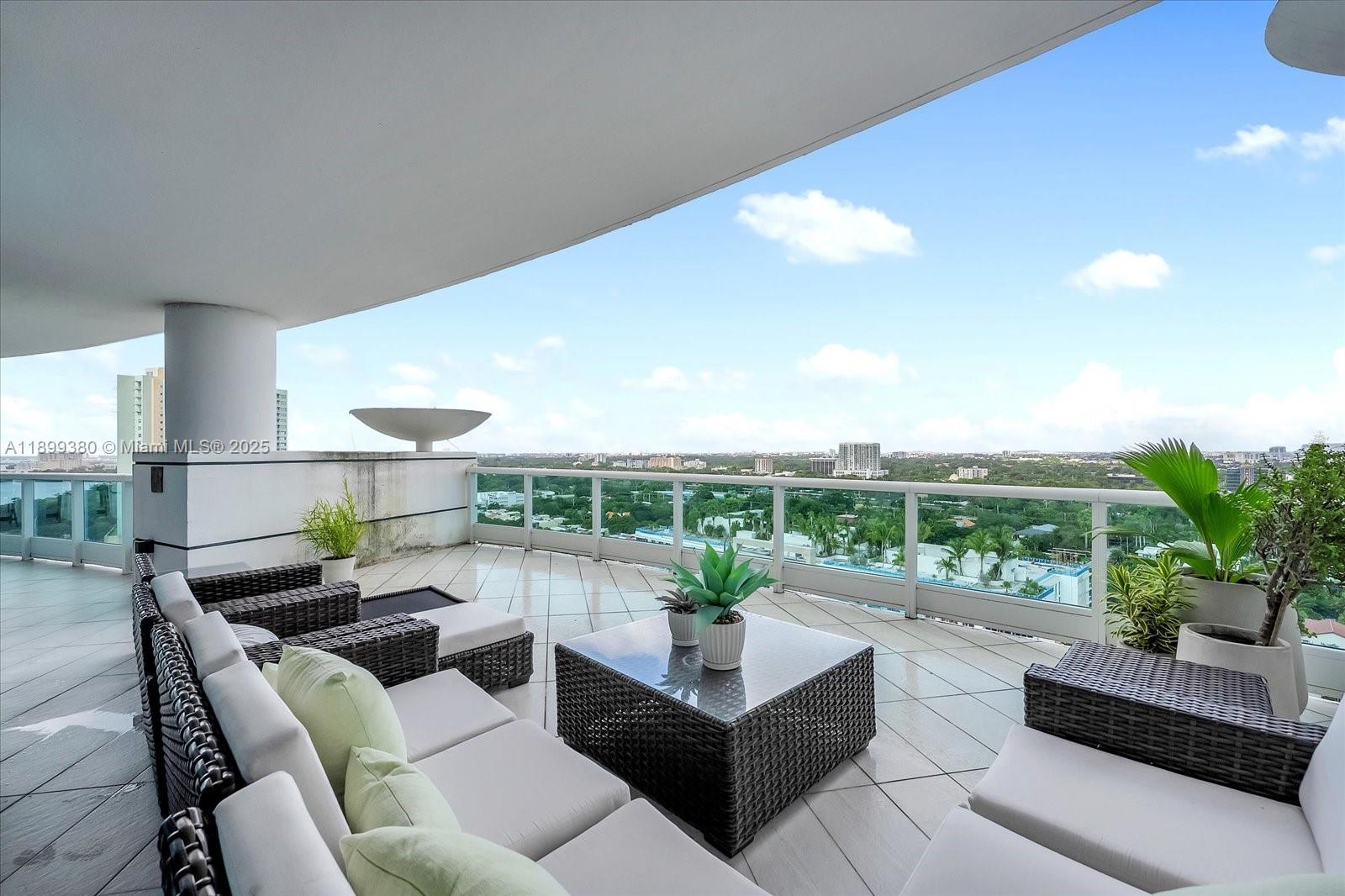 2127 Brickell Avenue, Unit 2005 Miami, FL 33129 - Photo 31 of 53 a living room with furniture and a potted plant