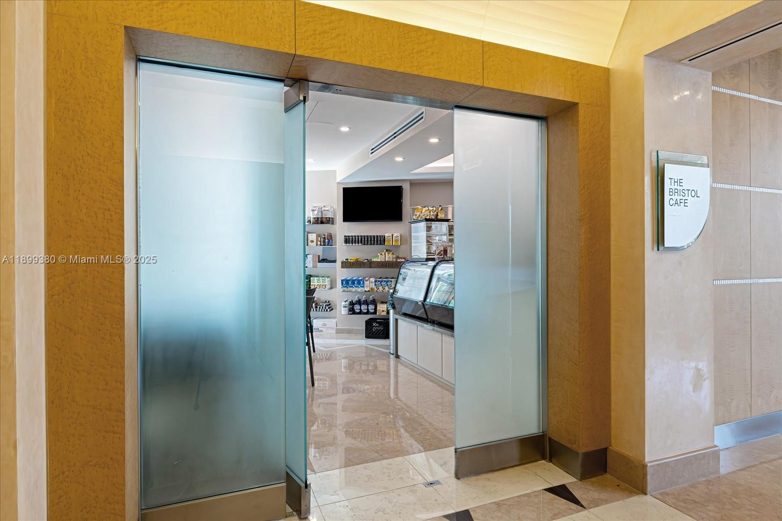 2127 Brickell Avenue, Unit 2005 Miami, FL 33129 - Photo 42 of 53 a view of a hallway with wooden shelves