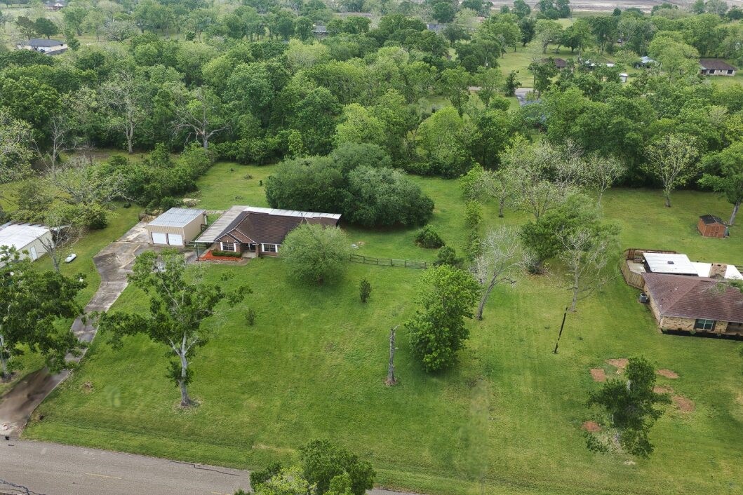 308 County Road 893B Angleton, TX 77515 - Photo 2 of 41 a view of a lake with a yard