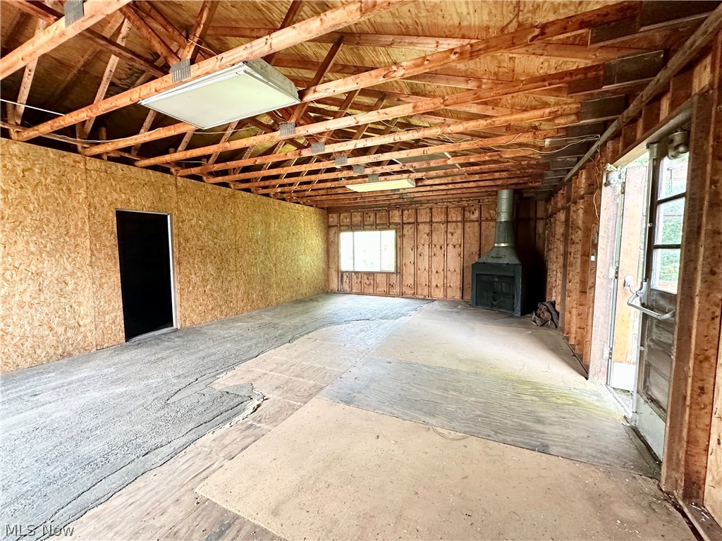 28 Richter Road Colliers, WV 26035 - Photo 37 of 38 Upper level of garage featuring a wood burner