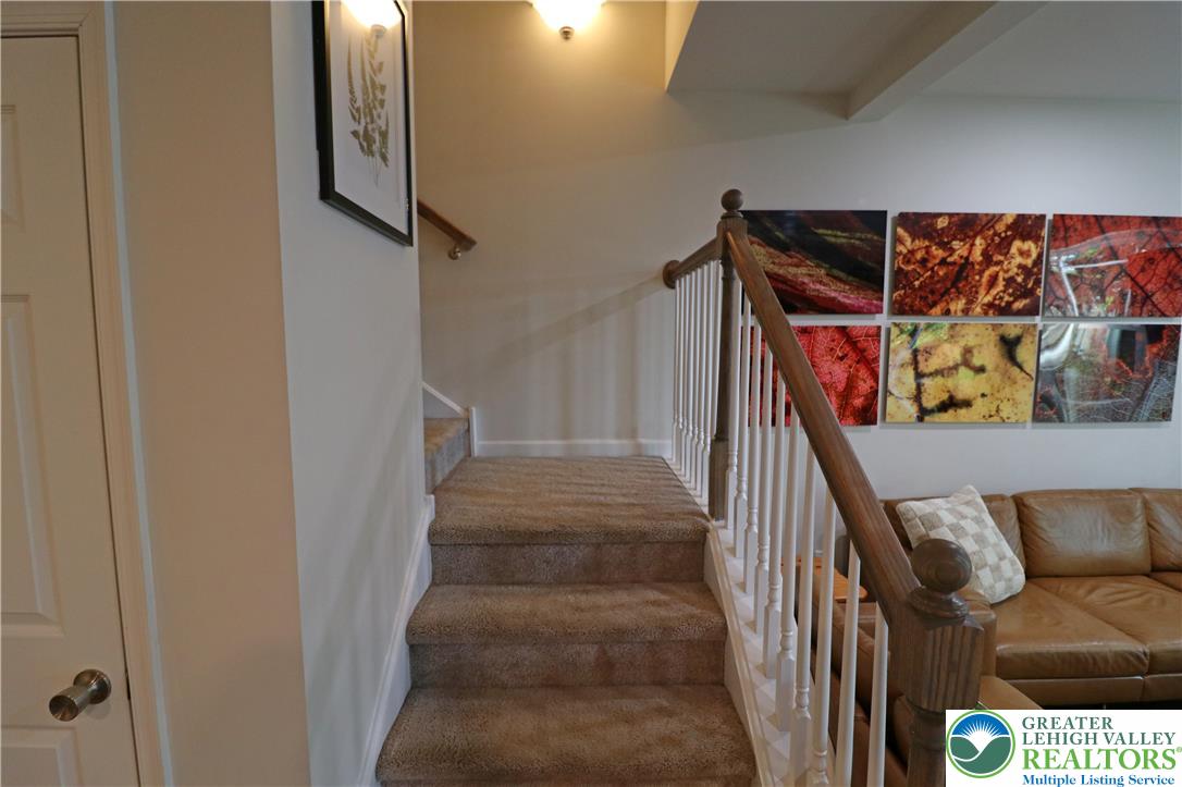 4502 Benjamin Court Emmaus, PA 18049 - Photo 21 of 53 A warm staircase leads the way to a cozy living space, perfect for quiet evenings.
