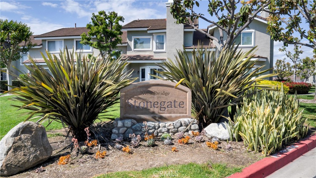 336 Fallingstar Irvine, CA 92614 - Photo 60 of 73 a front view of multi story residential apartment building with yard