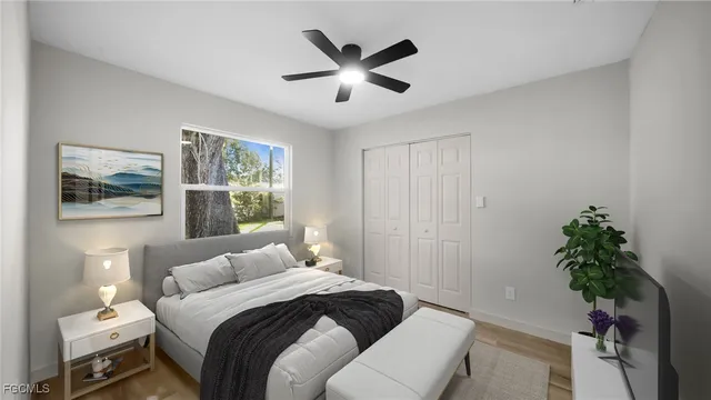 a bedroom with a large bed and a window